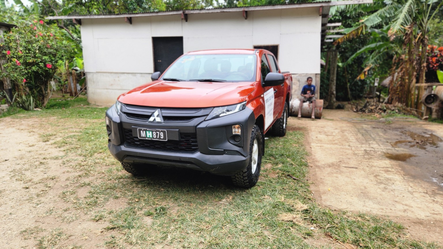 Red Mitsubishi double cab front view